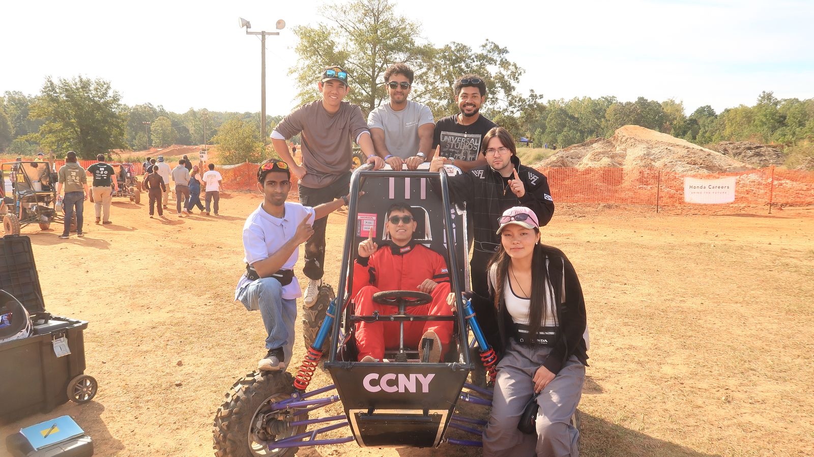 CCNY Racing team with their Baja car at competition